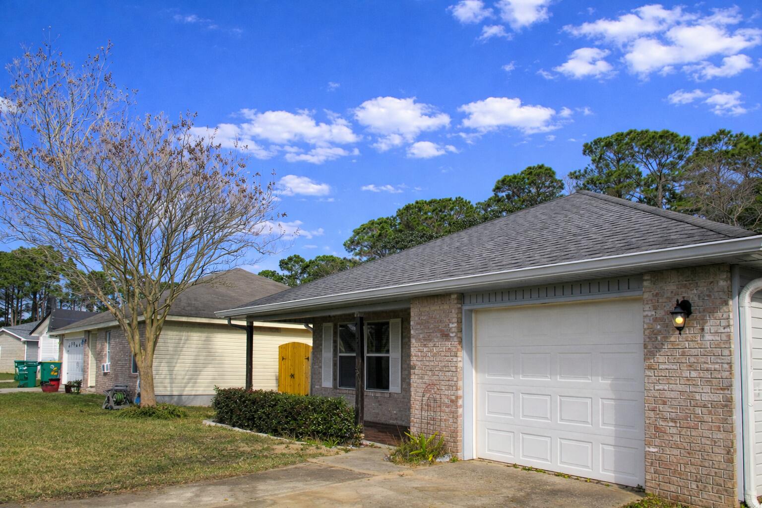 78 Stowe Road Mary Esther, FL 32569 - Photo 2 of 32 Exterior 3 with AI blue sky