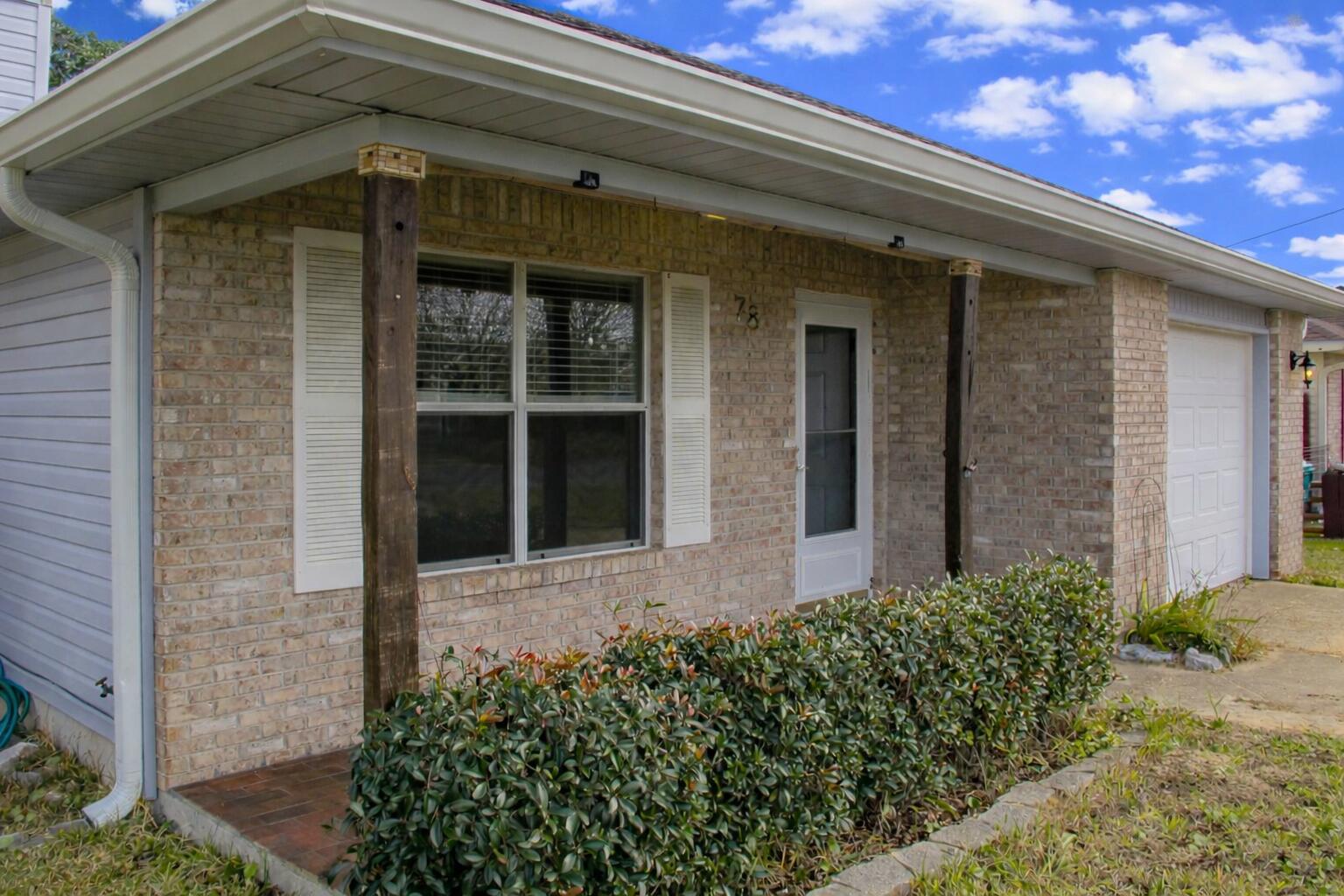 78 Stowe Road Mary Esther, FL 32569 - Photo 3 of 32 Front Porch 1 with AI blue sky