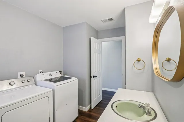 a bathroom with a toilet and a mirror