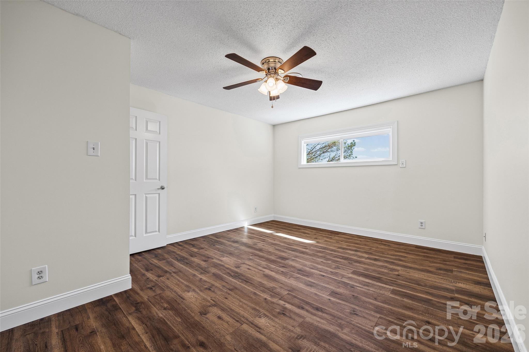 16149 Haroa Court Fort Mill, SC 29708 - Photo 18 of 40 a view of empty room with wooden floor