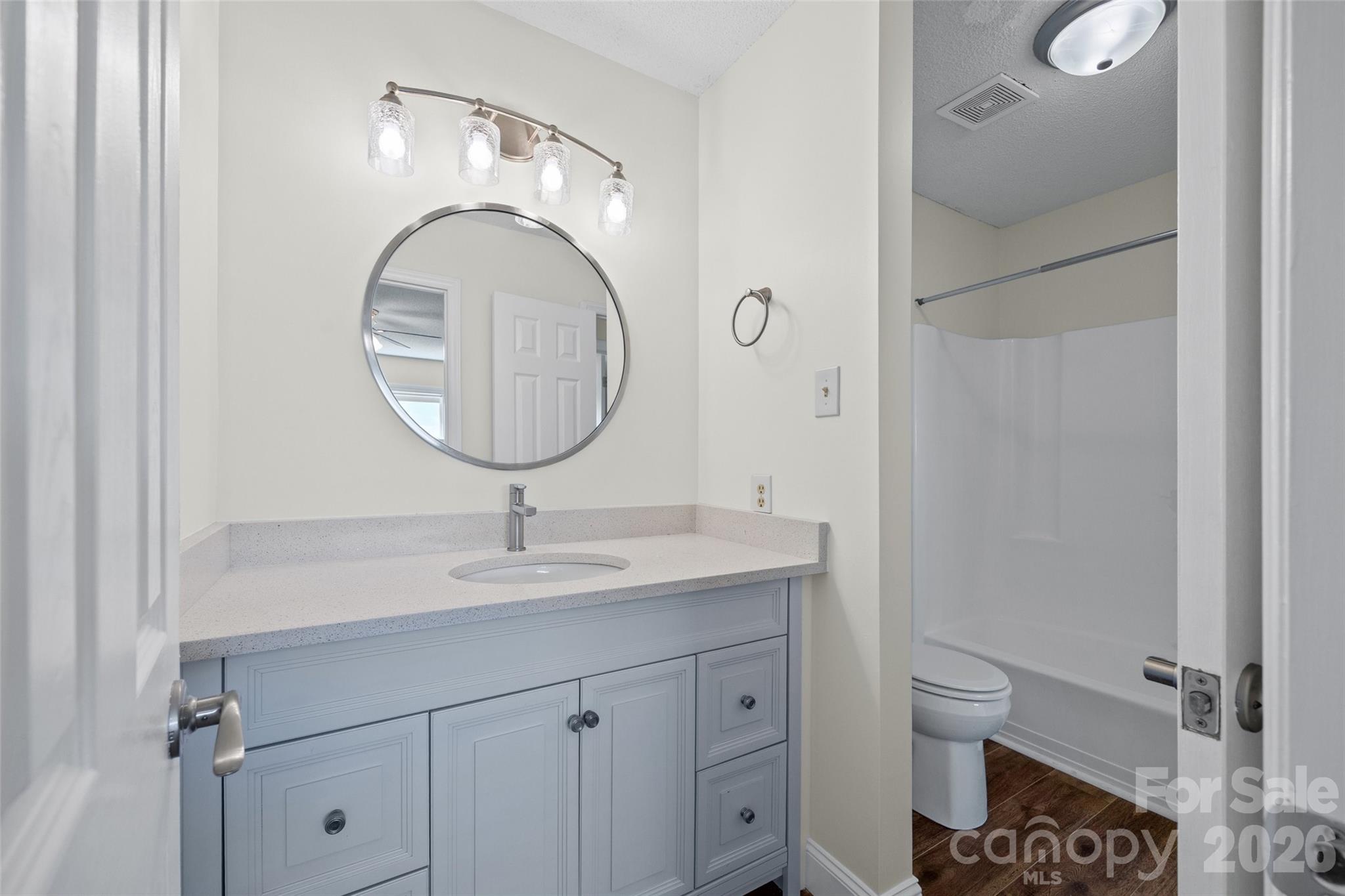 16149 Haroa Court Fort Mill, SC 29708 - Photo 20 of 40 a bathroom with a toilet sink and mirror