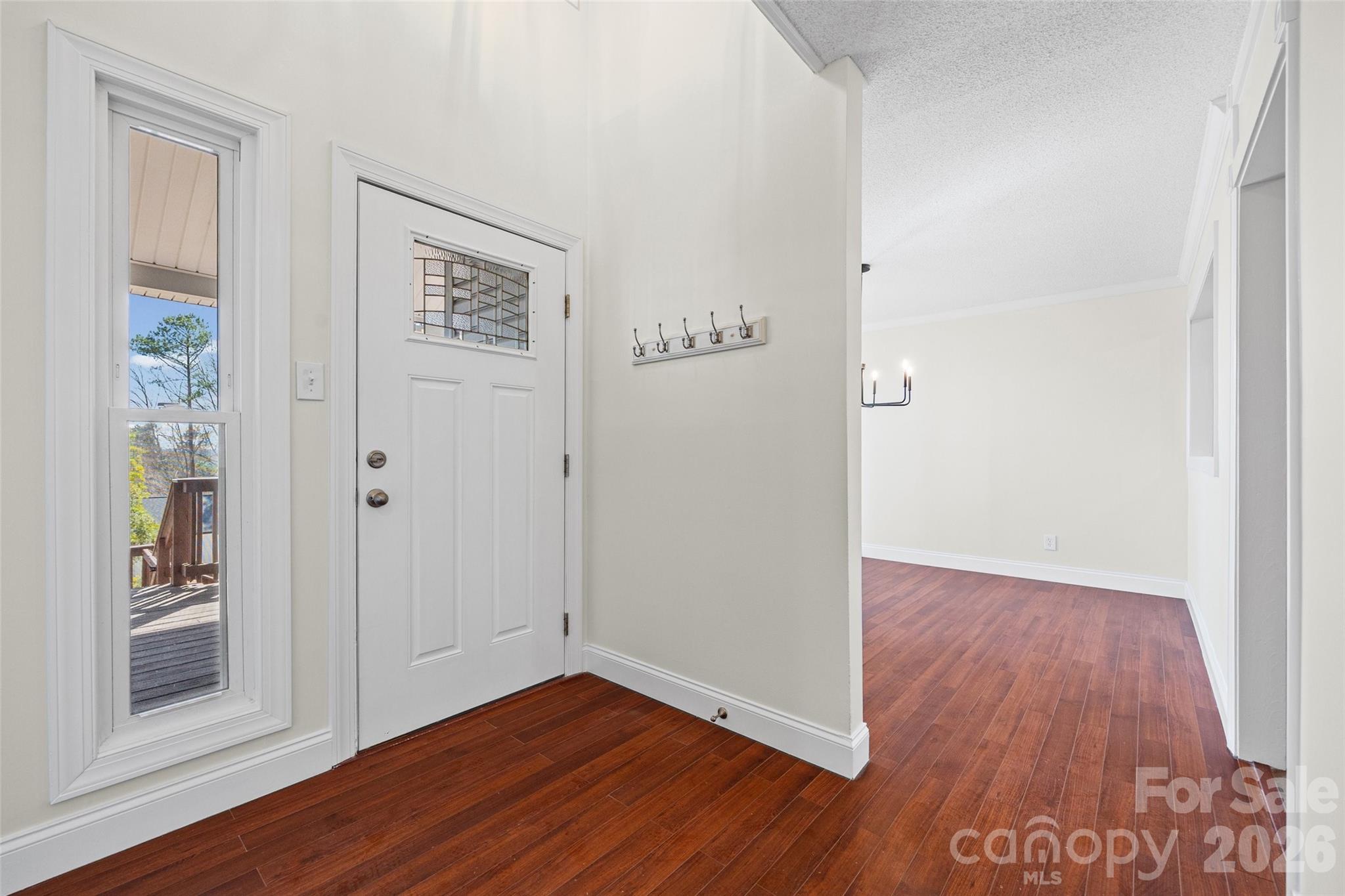 16149 Haroa Court Fort Mill, SC 29708 - Photo 4 of 40 an empty room with wooden floor and windows