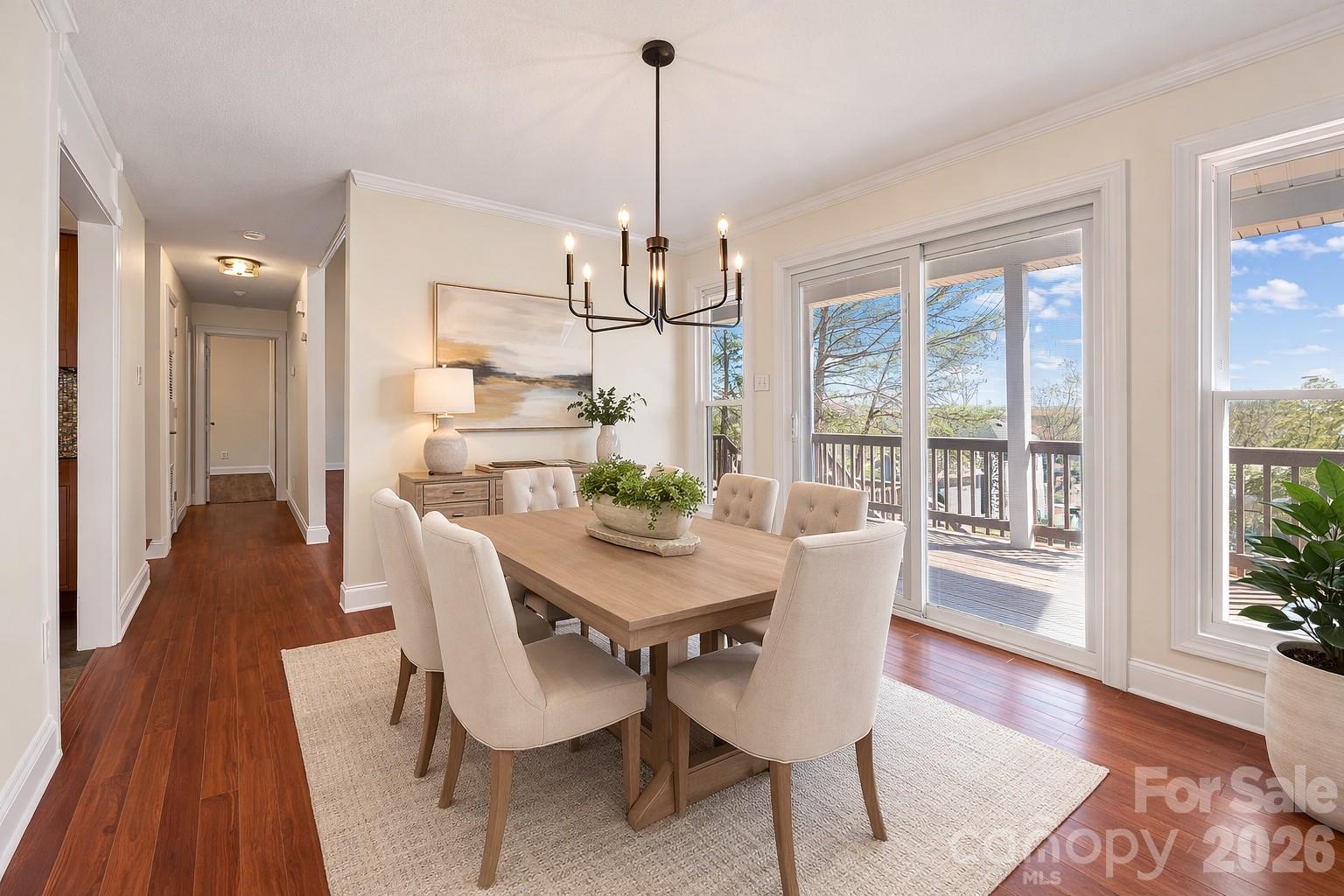 16149 Haroa Court Fort Mill, SC 29708 - Photo 8 of 40 a view of a dining room with furniture window and wooden floor