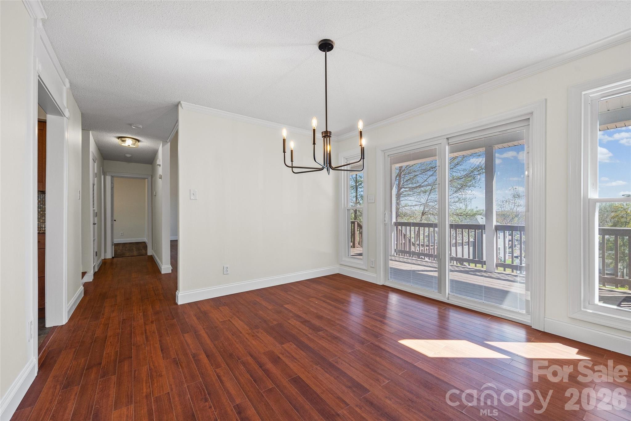 16149 Haroa Court Fort Mill, SC 29708 - Photo 9 of 40 a view of empty room with wooden floor and fan