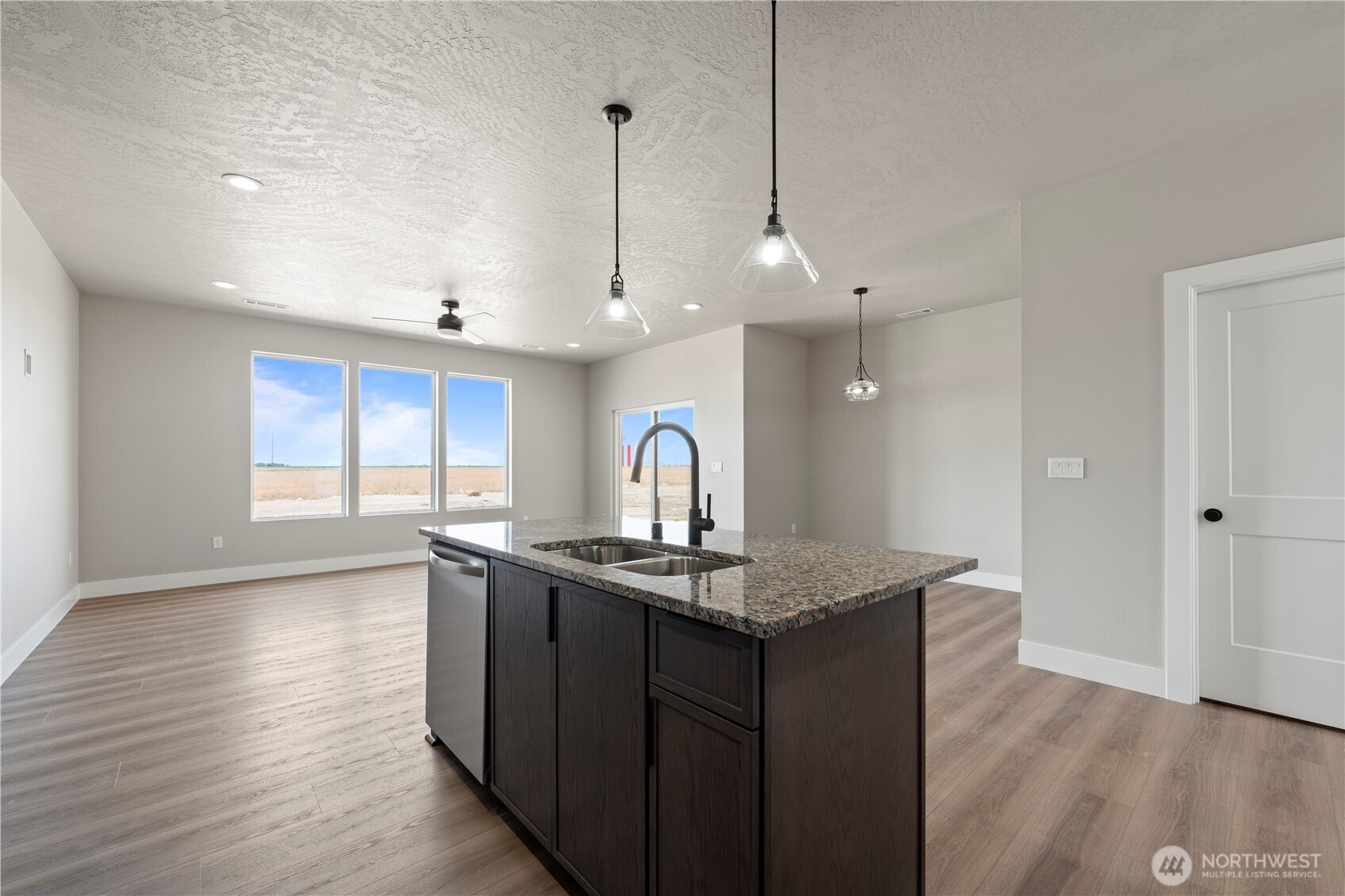 706 O Street Southwest Quincy, WA 98848 - Photo 16 of 33 a kitchen with a sink a counter space and wooden floor