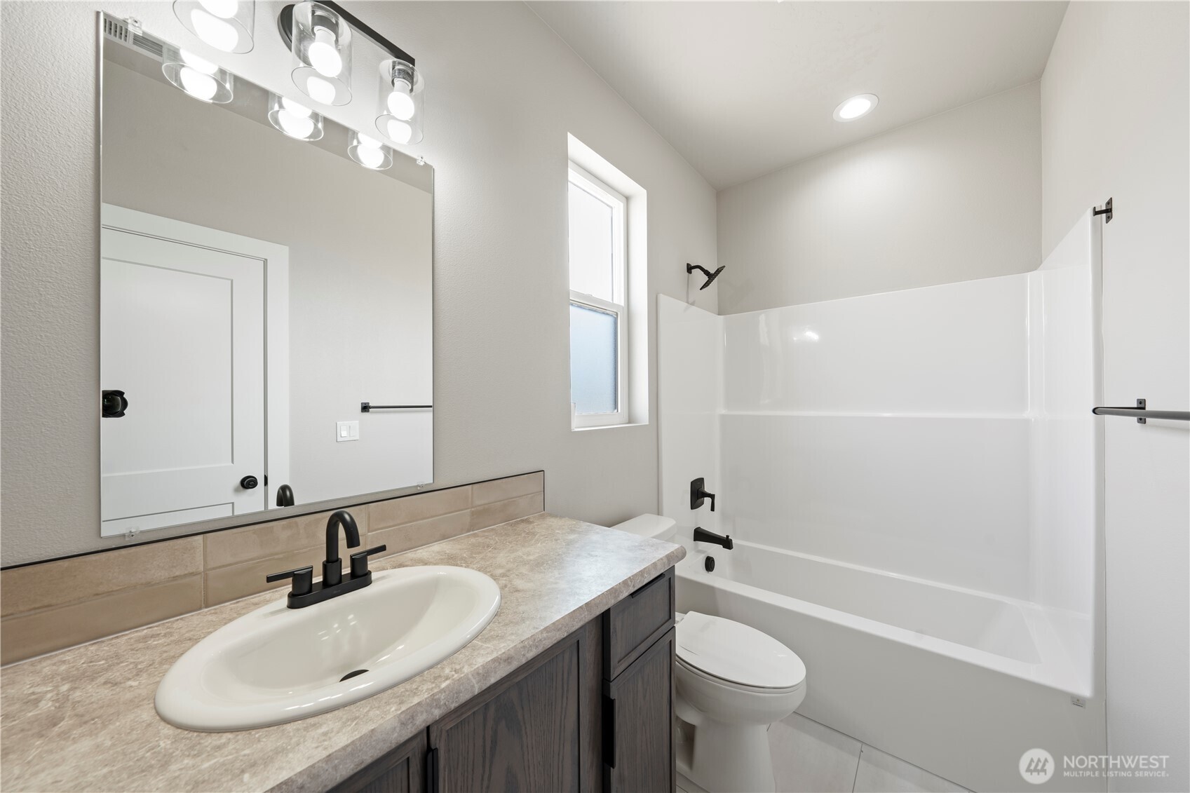 706 O Street Southwest Quincy, WA 98848 - Photo 23 of 33 a bathroom with a sink a toilet and shower