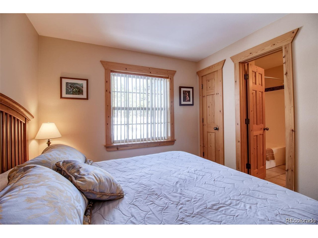 4 Lost Mine Loop, Unit 4B Leadville, CO 80461 - Photo 14 of 16 a bedroom with a bed and a window