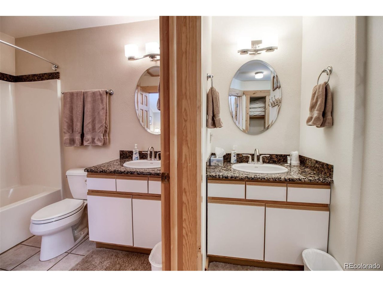 4 Lost Mine Loop, Unit 4B Leadville, CO 80461 - Photo 15 of 16 a bathroom with a sink a toilet and a mirror