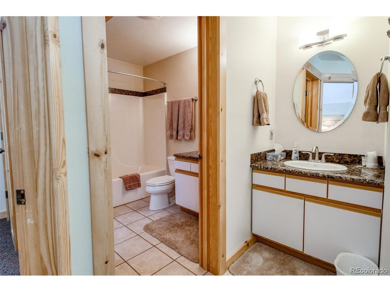 4 Lost Mine Loop, Unit 4B Leadville, CO 80461 - Photo 16 of 16 a bathroom with a sink and a mirror