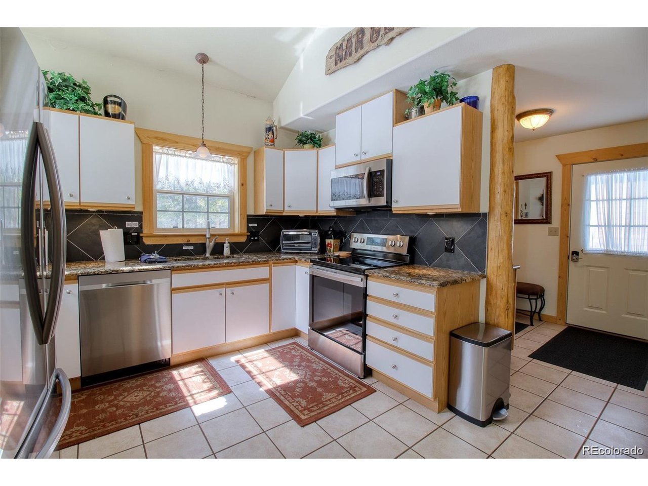 4 Lost Mine Loop, Unit 4B Leadville, CO 80461 - Photo 6 of 16 a kitchen with a sink appliances cabinets and a counter top space