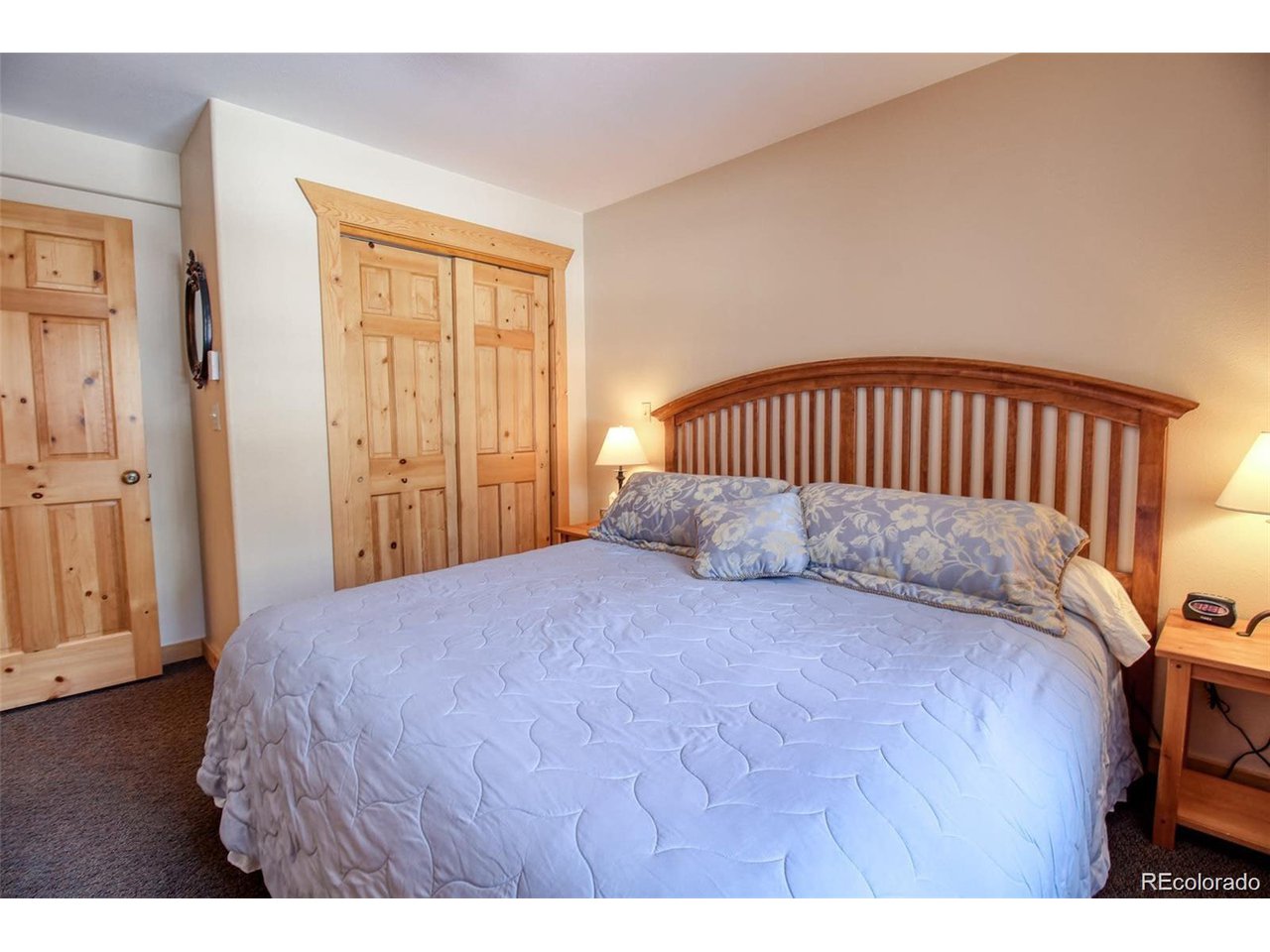 4 Lost Mine Loop, Unit 4B Leadville, CO 80461 - Photo 8 of 16 a bedroom with a bed and wooden floor