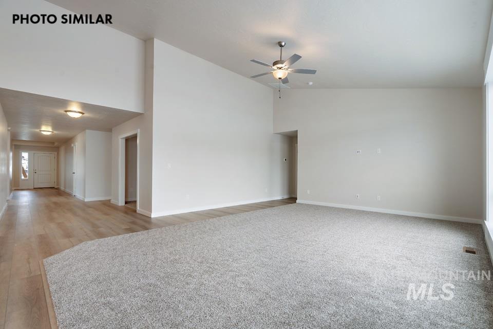 1645 Haystack Emmett, ID 83617 - Photo 6 of 33 Spacious interior featuring a combination of light-toned wood-finish flooring and grey carpet