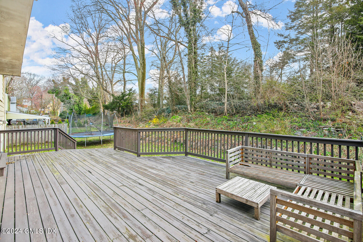 38 Amherst Road Riverside, CT 06878 - Photo 18 of 22 a view of a wooden deck with trees