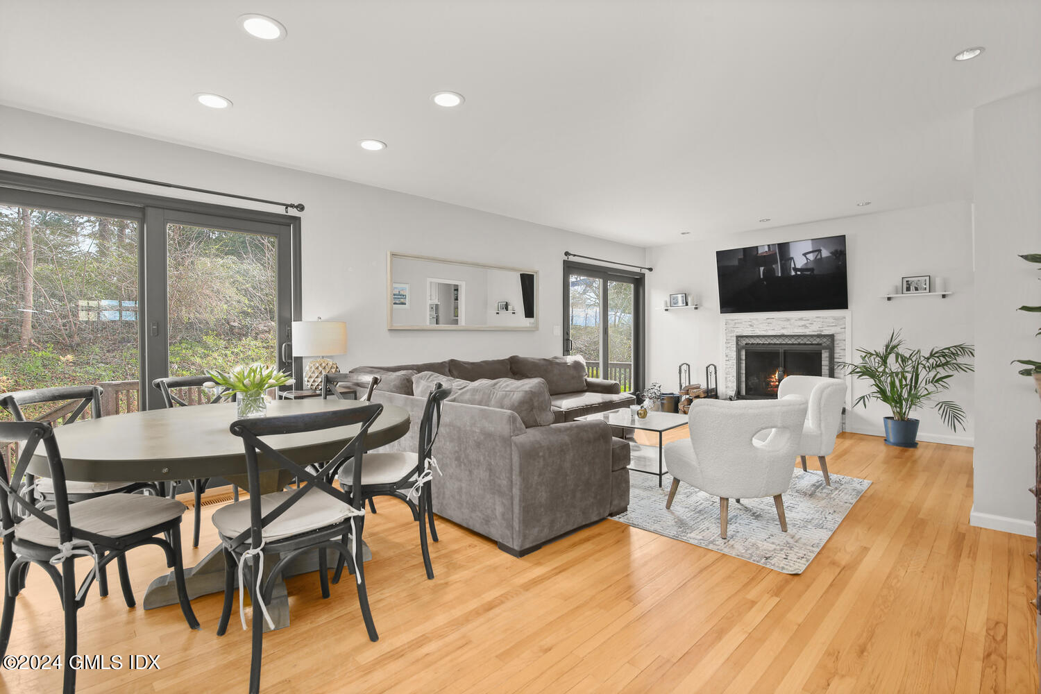 38 Amherst Road Riverside, CT 06878 - Photo 5 of 22 a living room with fireplace furniture and a flat screen tv