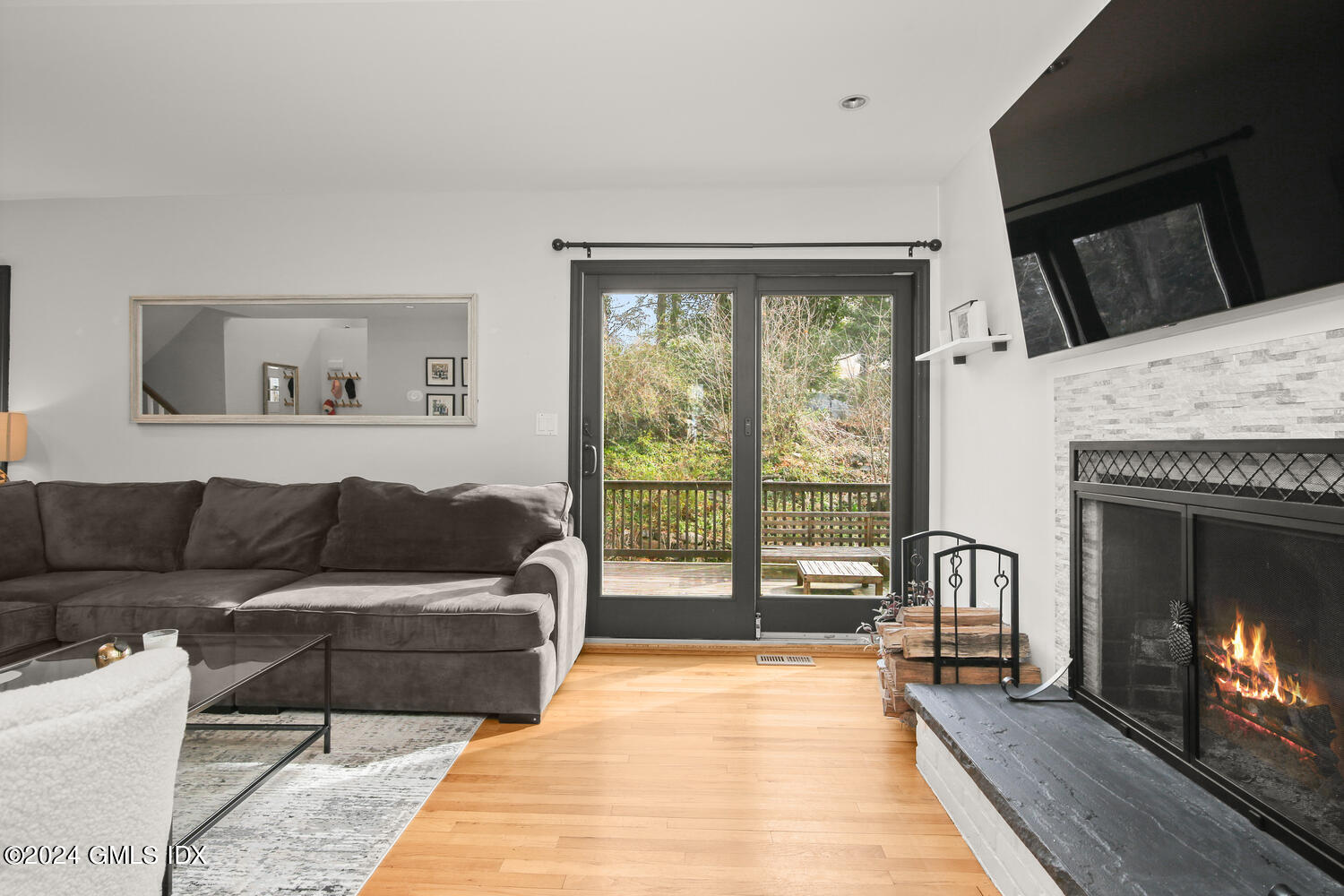 38 Amherst Road Riverside, CT 06878 - Photo 7 of 22 a living room with furniture and a fireplace