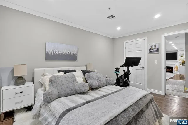 a bed room with furniture and a flat screen tv