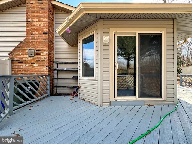 a view of an empty room and wooden floor