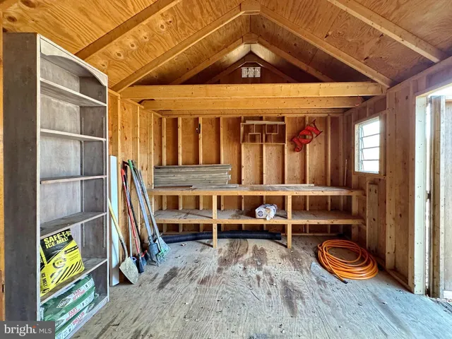 a large kitchen with stainless steel appliances granite countertop a refrigerator oven a sink dishwasher a stove and a refrigerator