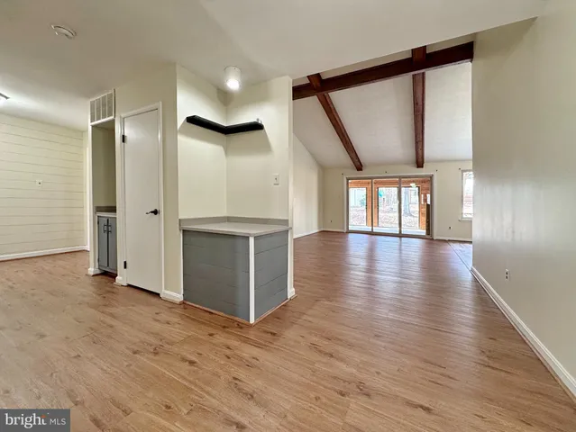 a stove top oven sitting inside of a kitchen