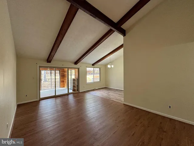 a kitchen with stainless steel appliances granite countertop cabinets and window