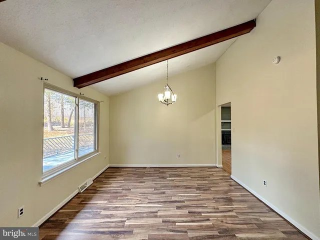 a view of cabinets with wooden floor