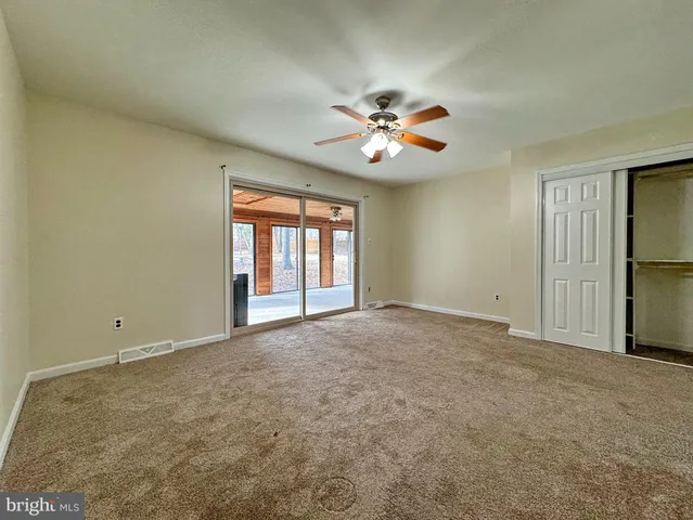 a view of a kitchen with a sink dishwasher stove and wooden floor