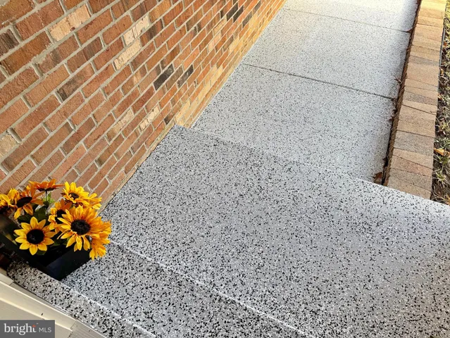 a view of a house with a yard covered in snow