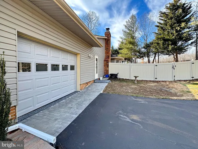 a view of outdoor space and deck with wooden floor