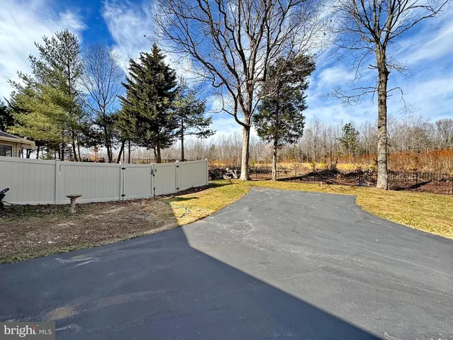 a view of an empty room with windows