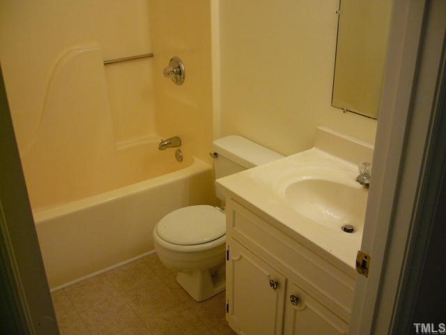 2547 Ross Road Durham, NC 27703 - Photo 5 of 12 a bathroom with a sink and toilet