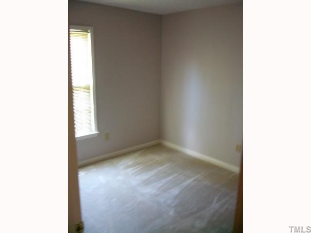 2547 Ross Road Durham, NC 27703 - Photo 6 of 12 a view of an empty room with a window