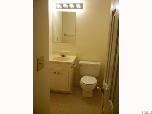 2547 Ross Road Durham, NC 27703 - Photo 9 of 12 a bathroom with a sink and a toilet