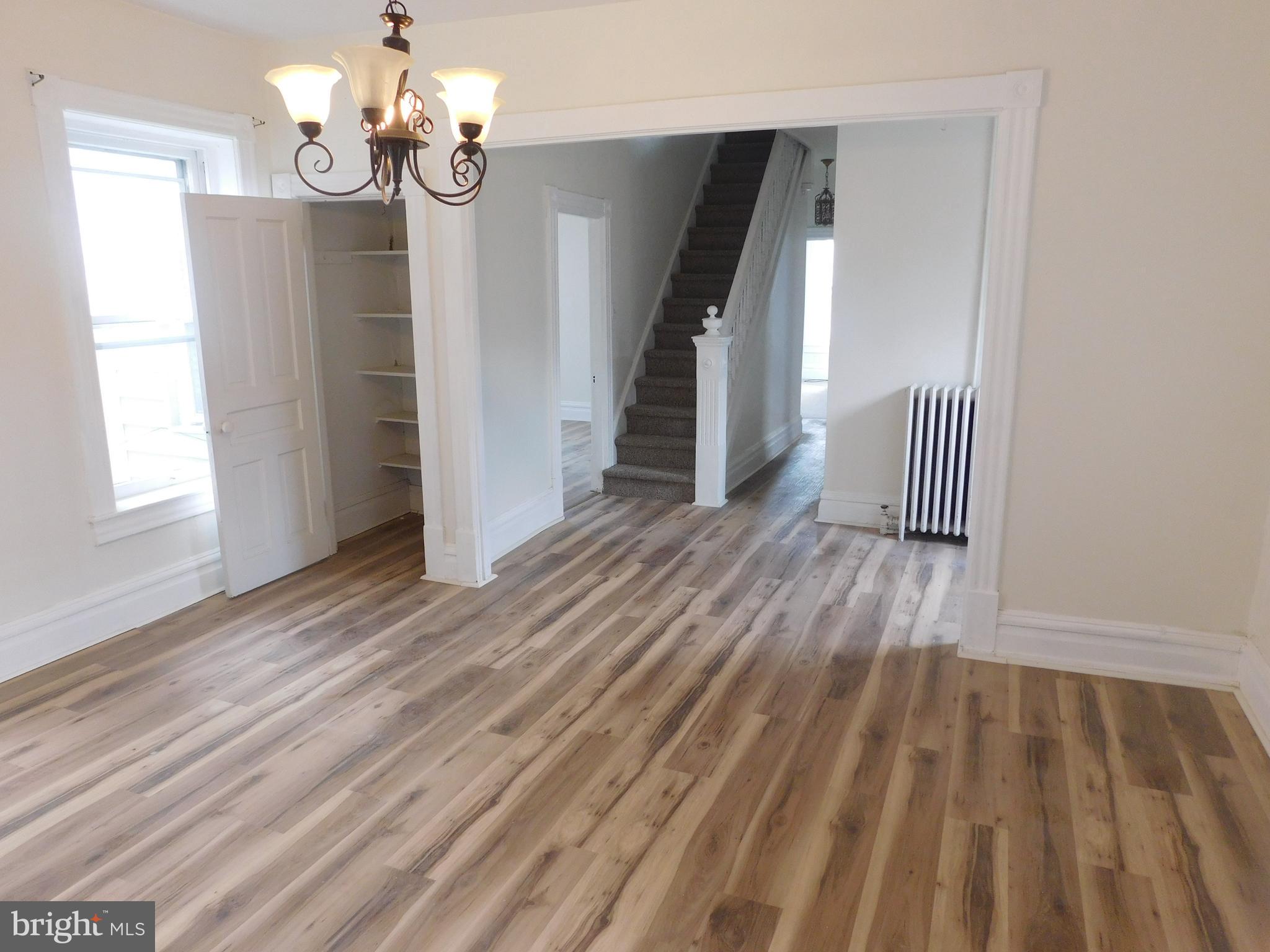 247 East 3rd Street Lewistown, PA 17044 - Photo 14 of 24 wooden floor in an empty room with a window