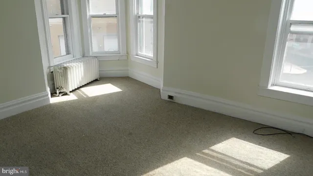 an empty room with windows