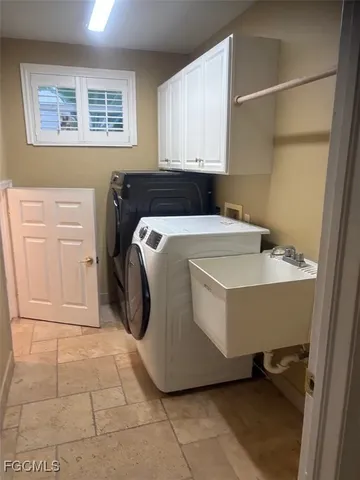 a utility room with cabinets