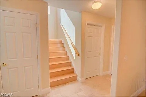 12398 Rock Ridge Lane Fort Myers, FL 33913 - Photo 22 of 43 a view of entryway with wooden floor