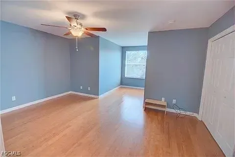 a view of a room with wooden floor