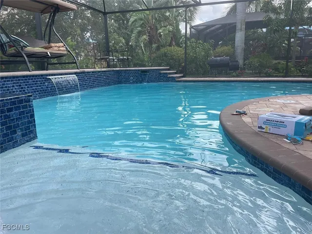 a view of a backyard with sitting area