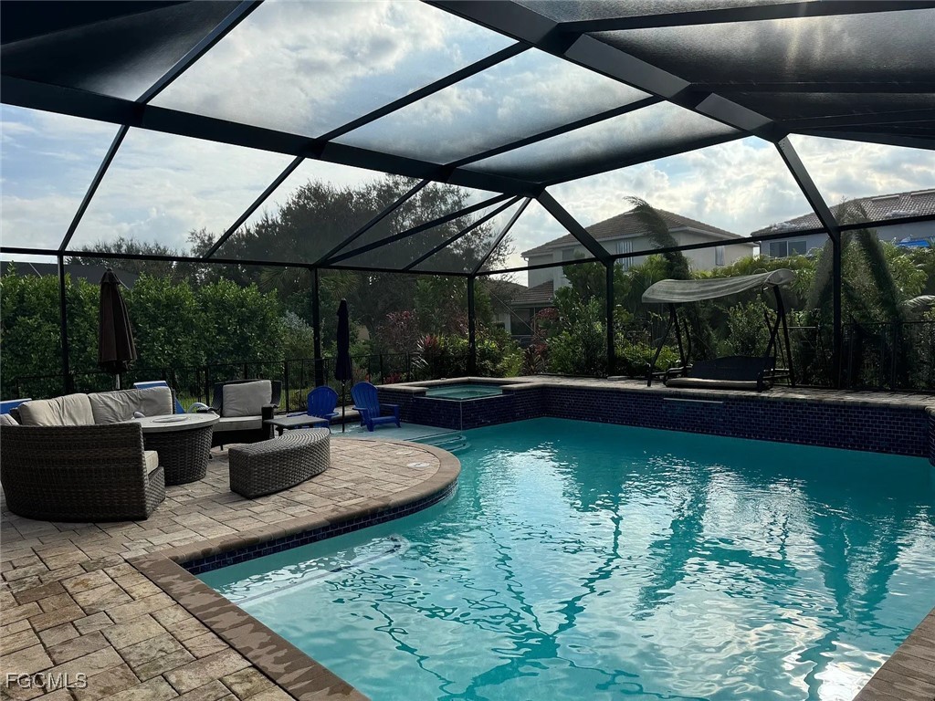 12398 Rock Ridge Lane Fort Myers, FL 33913 - Photo 35 of 43 a view of swimming pool with outdoor seating