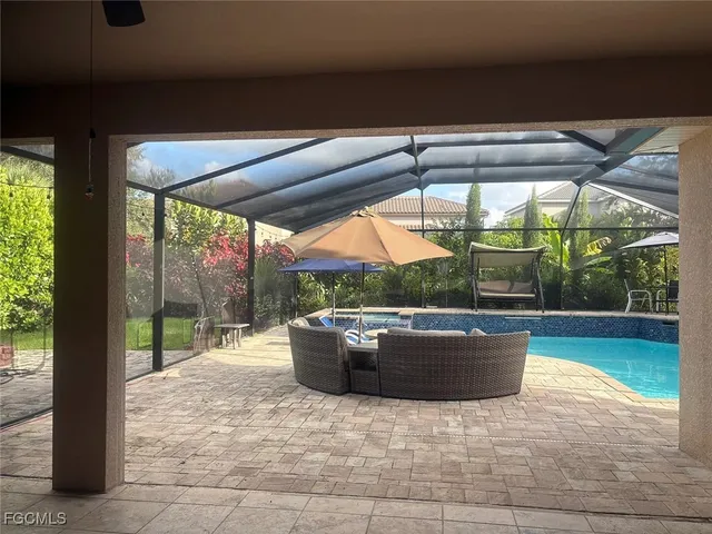 a view of patio with swimming pool