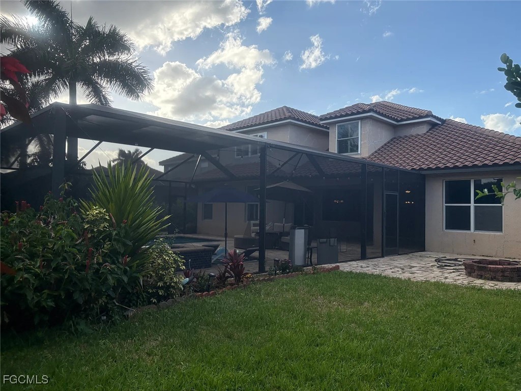 12398 Rock Ridge Lane Fort Myers, FL 33913 - Photo 39 of 43 a view of a backyard with plants and large tree