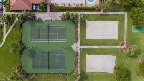 a green field in front of the house