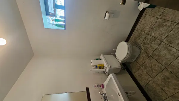 a bathroom with a toilet and a sink