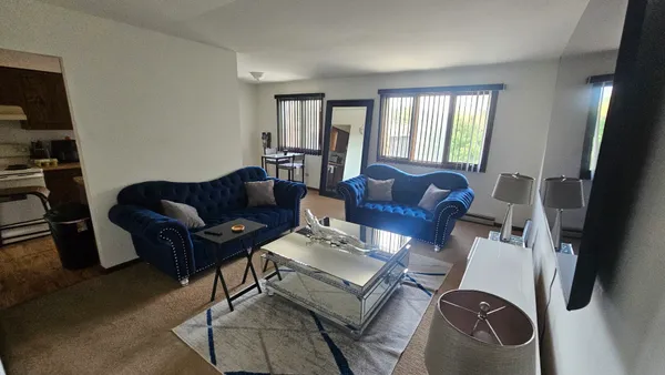 a living room with furniture and a window