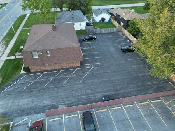 an aerial view of a house with a yard