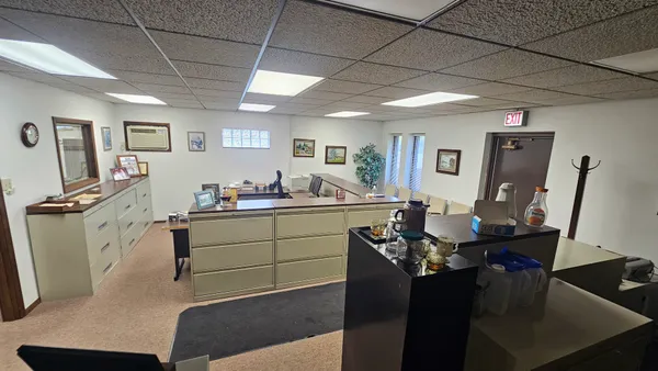 a view of a workspace with furniture