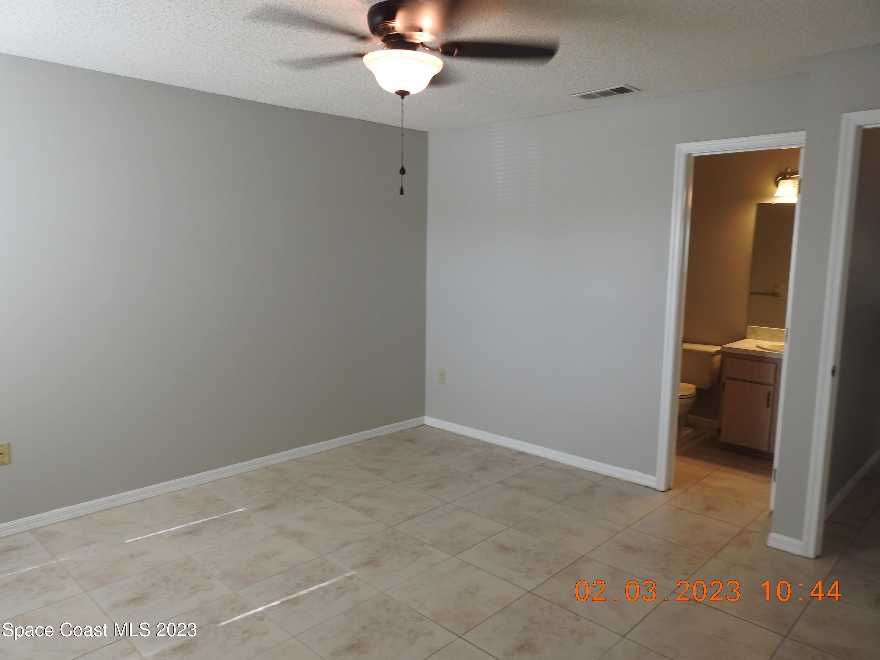 4020 Bayberry Drive Melbourne, FL 32901 - Photo 11 of 26 a view of a room with a hanging light and hardwood floor