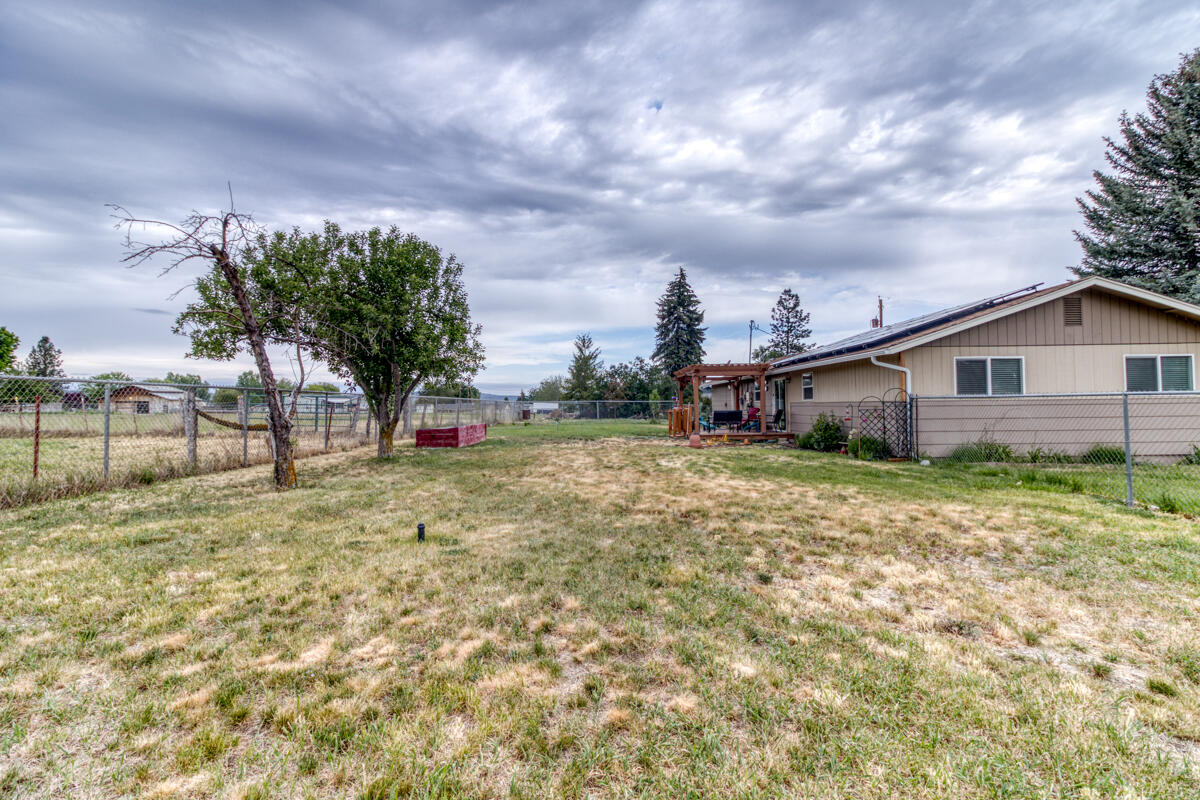 566 Northwest Mc Donald Road Prineville, OR 97754 - Photo 29 of 41 a view of a house with backyard and a tree