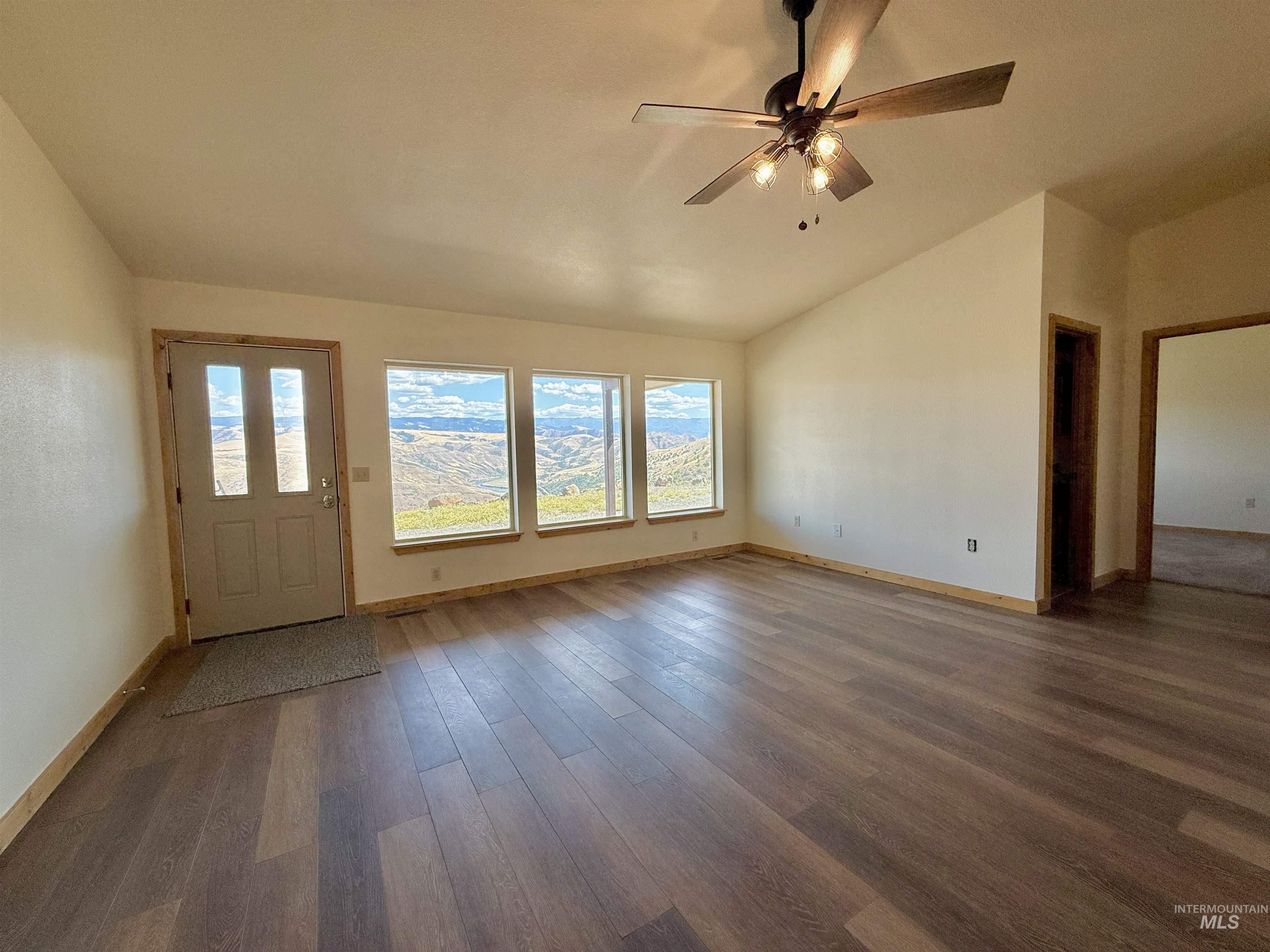 150 Buck Boulevard White Bird, ID 83554 - Photo 4 of 45 Foyer with lofted ceiling, wood finished floors, and a ceiling fan