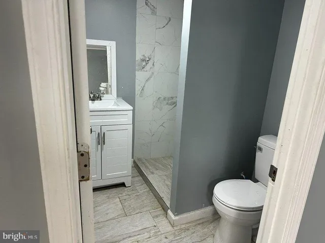 a bathroom with a sink and toilet
